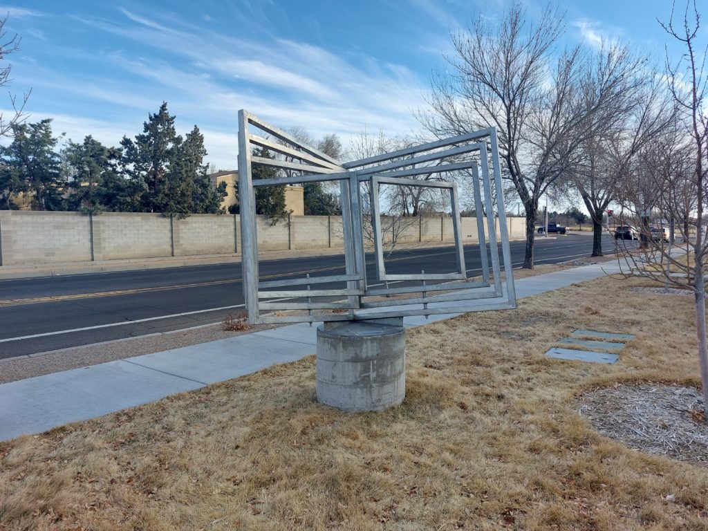 Metal sculpture titled 'Los Libros' by John B. Northcutt.