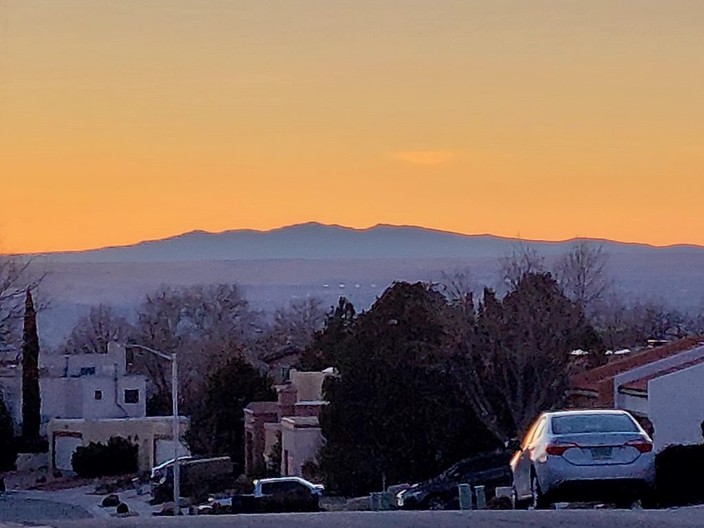 View of the volcanoes during sunset from Quintessence neighborhood.