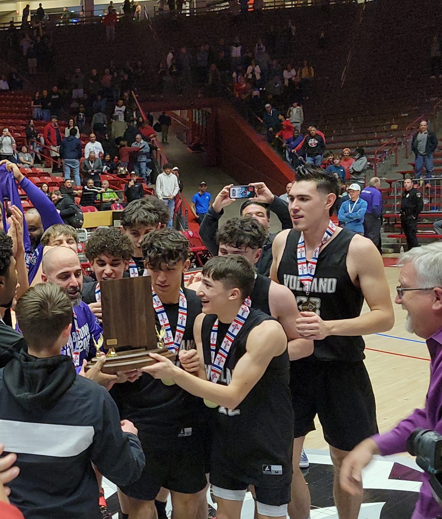 Volcano Vista players celebrate after winning the state championship Saturday in the Pit.