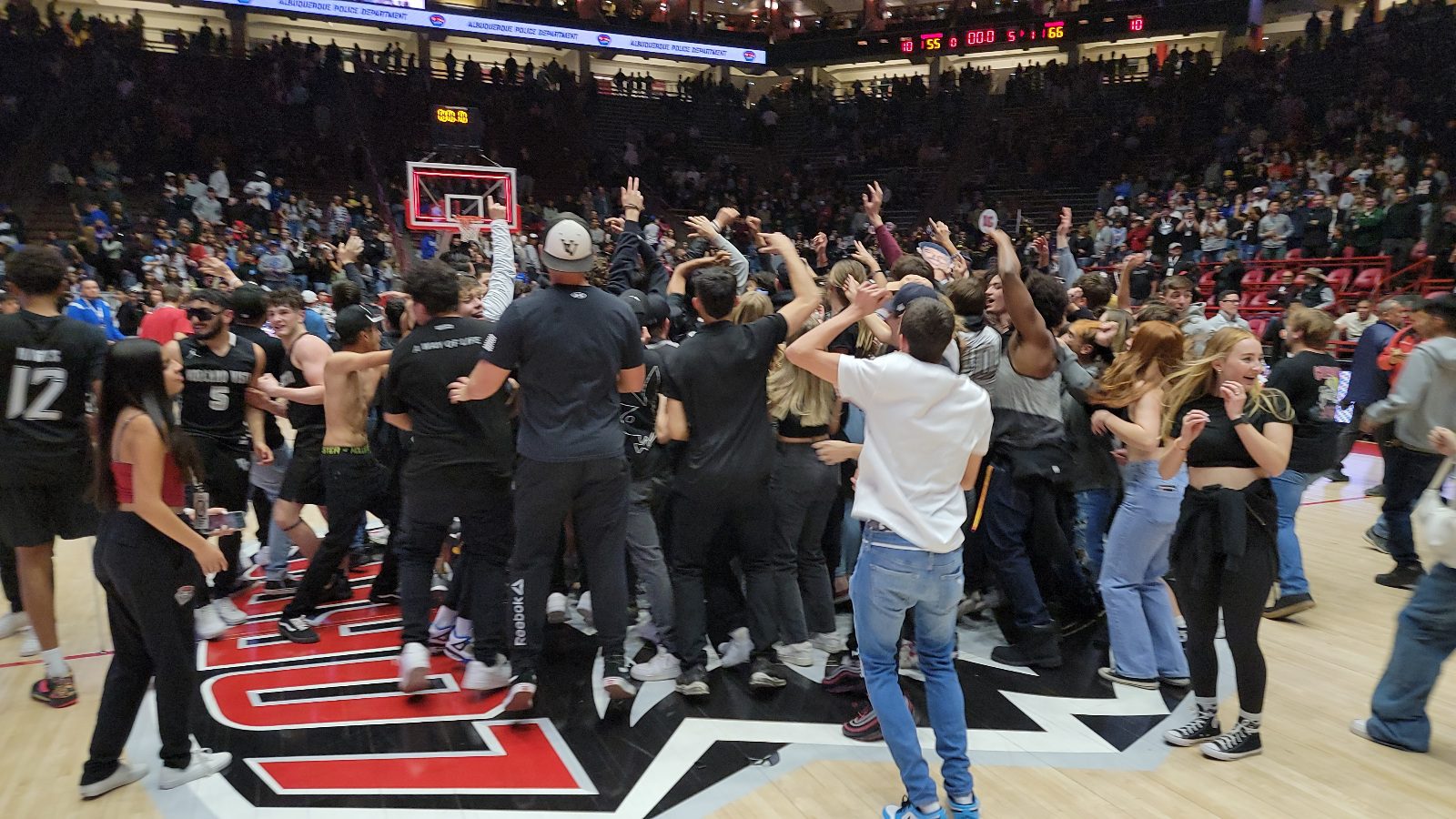 Volcano Vista fans storm the court at the Pit to celebrate with players after the team won the Class 5A championship in March.