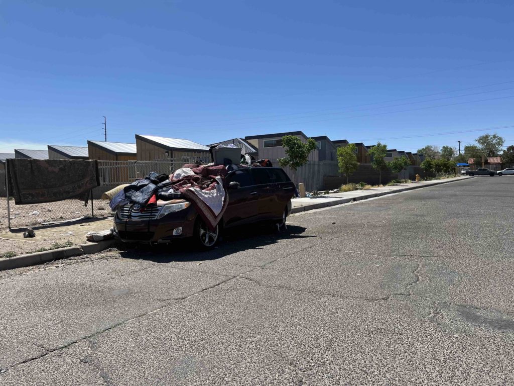 Car in front of Tiny Home Village