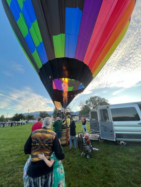 The flame can be seen as Knight Rider tethers at Sombre Del Monte Elementary Friday as part of Albuquerque loft. (Scott Albright/Neighborhood Journal)