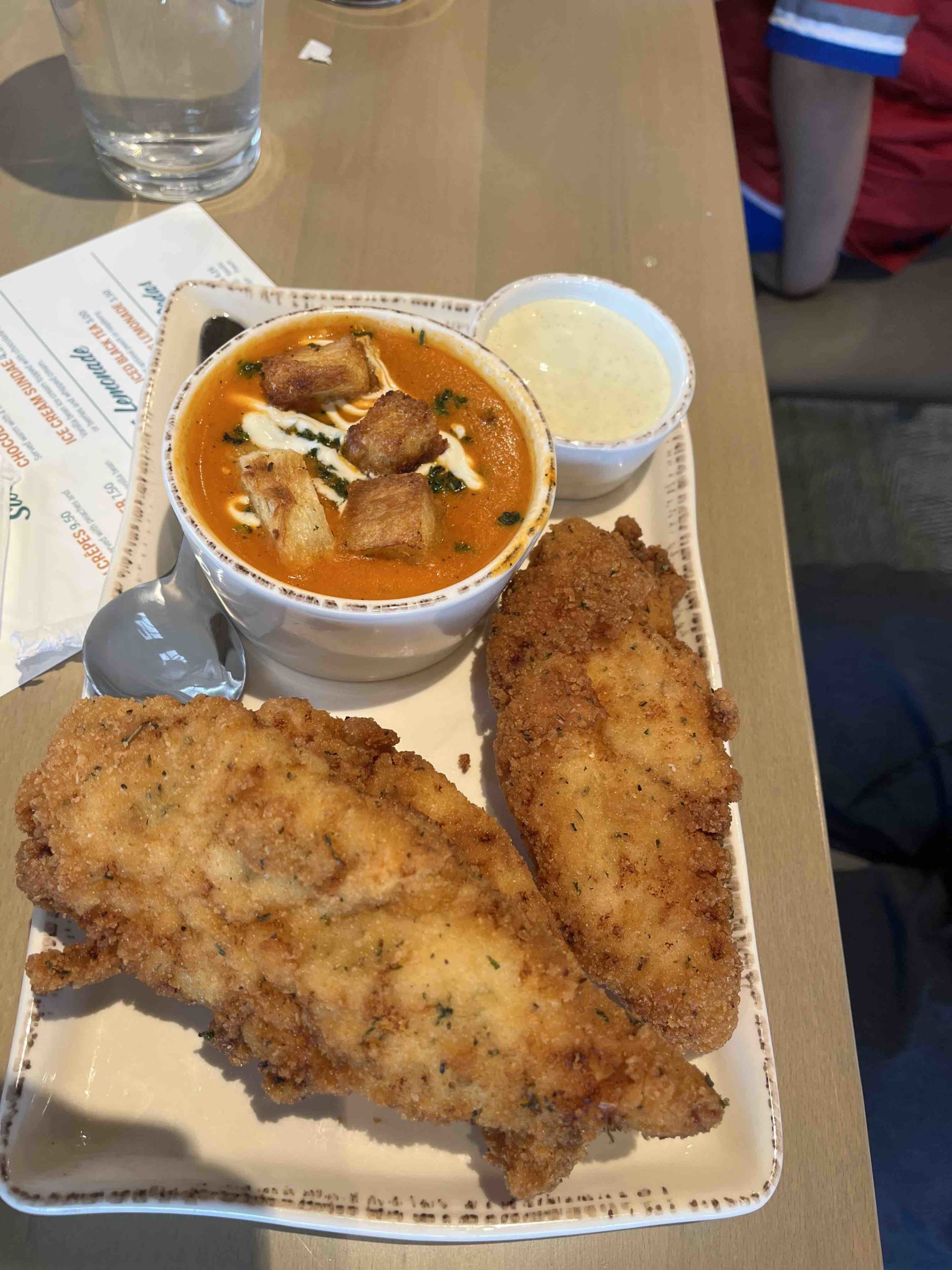 Hand breaded chicken strips and tomato bisque