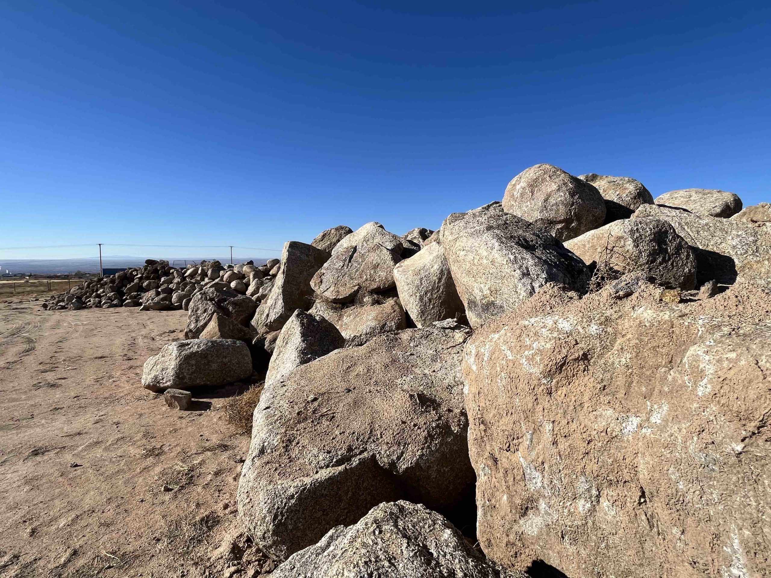 Boulders are piled to the north of NDB Dam. (Scott Albright/Neighborhood Journal)