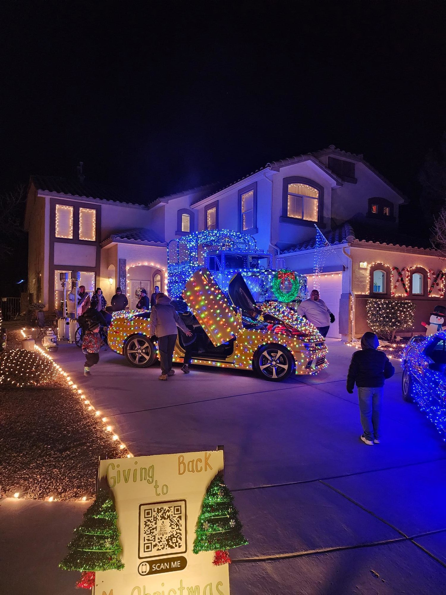 Nate Bywater, who helped organize a fundraiser to help his neighbor Dave Plourde (AKA Mr. Christmas), had the iconic cars on display at his house in northwest Albuquerque Friday and Saturday night.