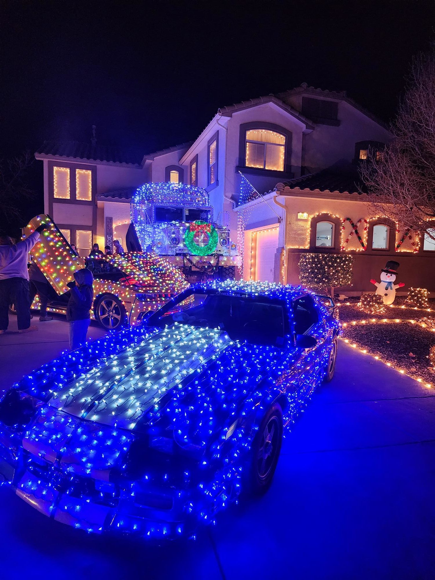 Nate Bywater, who helped organize a fundraiser to help his neighbor Dave Plourde (AKA Mr. Christmas), had the iconic cars on display at his house in northwest Albuquerque Friday and Saturday night.