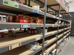 Shelves at McKinney-Vento warehouse. McKinney-Vento food donation drive